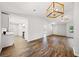 Open-concept living space boasts hardwood floors, vaulted ceilings, and a kitchen with stainless appliances at 3435 Stallion Ct, Powder Springs, GA 30127