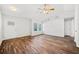Living room featuring hardwood floors, neutral walls, and lots of natural light from large windows at 3435 Stallion Ct, Powder Springs, GA 30127