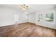 Living room with hardwood floors, vaulted ceilings, and a view of the front yard through large windows at 3435 Stallion Ct, Powder Springs, GA 30127