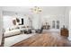 Bright living room features hardwood floors, neutral walls, vaulted ceilings and stylish, modern decor at 3435 Stallion Ct, Powder Springs, GA 30127