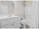 Clean bathroom with a white vanity, toilet, and shower-tub combo with curtain at 41 Balsam Dr, Dallas, GA 30157