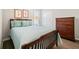 Charming bedroom with a wooden bed frame, dresser, and ample closet space at 41 Balsam Dr, Dallas, GA 30157