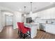Open kitchen with white cabinets, granite counters, stainless appliances and views of the front door and hallway at 41 Balsam Dr, Dallas, GA 30157