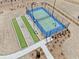 Aerial view of a well-maintained tennis court and bocce ball area with professional fencing at 41 Balsam Dr, Dallas, GA 30157