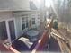 Spacious back deck with outdoor seating, a grill, and scenic views of the yard at 70 Trelawney Cir, Covington, GA 30016