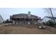 Back of house with a multi-level deck and steps leading to the yard at 70 Trelawney Cir, Covington, GA 30016