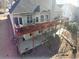 Home featuring a large deck with outdoor furniture and a spacious backyard at 70 Trelawney Cir, Covington, GA 30016