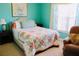 Bright bedroom with colorful bedding and a comfortable armchair at 70 Trelawney Cir, Covington, GA 30016