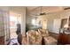Bright bedroom with tray ceiling, sitting area, and French door to balcony at 70 Trelawney Cir, Covington, GA 30016