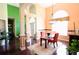 Bright dining room with glass-top table and stylish chandelier at 70 Trelawney Cir, Covington, GA 30016