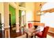 Bright dining room with glass-top table and stylish chandelier at 70 Trelawney Cir, Covington, GA 30016