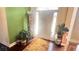 Bright foyer with hardwood floors, elegant décor, and a charming entryway at 70 Trelawney Cir, Covington, GA 30016