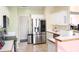 Kitchen featuring stainless steel appliances, white cabinets, and tile floors at 70 Trelawney Cir, Covington, GA 30016