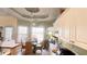 Kitchen featuring bright lighting, a dining area, cream cabinets, and stainless steel appliances at 70 Trelawney Cir, Covington, GA 30016