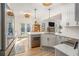 Modern kitchen with white cabinets, stainless steel appliances, and a view to the backyard at 113 Windsong Trl, Canton, GA 30114