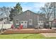 A backyard featuring a spacious wooden deck with outdoor seating and dining surrounded by lush green grass at 1552 Newton Se Ave, Atlanta, GA 30316