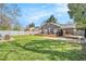 Expansive backyard with wooden deck, lush green lawn, hardscape patio, and privacy fence, perfect for outdoor living at 1552 Newton Se Ave, Atlanta, GA 30316
