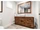 Stylish bathroom with modern vanity, vessel sink, and large decorative mirror with accent lighting at 1552 Newton Se Ave, Atlanta, GA 30316