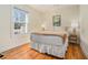 Comfortable bedroom featuring a queen-sized bed and bright natural light from window at 1552 Newton Se Ave, Atlanta, GA 30316