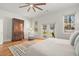 Bright bedroom with hardwood floors, ceiling fan, and access to backyard patio at 1552 Newton Se Ave, Atlanta, GA 30316