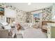 Brightly decorated bedroom with patterned wallpaper, sitting area, and a wooden crib at 1552 Newton Se Ave, Atlanta, GA 30316