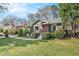 Charming home with inviting front yard, landscaped garden, and cozy seating area on a beautiful sunny day at 1552 Newton Se Ave, Atlanta, GA 30316