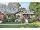 Charming stucco home featuring a red front door, manicured landscaping, and a walkway leading to the entrance at 1552 Newton Se Ave, Atlanta, GA 30316