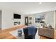 Cozy living room with a modern fireplace, shiplap accent wall, and hardwood floors at 1552 Newton Se Ave, Atlanta, GA 30316
