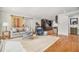 Spacious living room with hardwood floors, a modern barn door, and access to the kitchen at 1552 Newton Se Ave, Atlanta, GA 30316