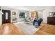 Bright living room featuring hardwood floors, neutral paint, large windows, and stylish décor at 1552 Newton Se Ave, Atlanta, GA 30316