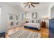 Bright and airy main bedroom with hardwood floors, ceiling fan, and private patio access at 1552 Newton Se Ave, Atlanta, GA 30316