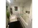 Well-lit bathroom featuring a marble countertop vanity and a tiled shower with glass doors at 3060 Pharr Court North Nw # 306, Atlanta, GA 30305