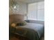 Calming bedroom with a plush bed, decorative pillows, and ample natural light from the window at 3060 Pharr Court North Nw # 306, Atlanta, GA 30305