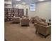Cozy library with armchairs, bookshelves, and natural light from a window at 3060 Pharr Court North Nw # 306, Atlanta, GA 30305