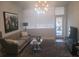 Cozy living room featuring a plush sofa, area rug, and modern decor at 3060 Pharr Court North Nw # 306, Atlanta, GA 30305