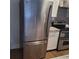 Stainless steel refrigerator with bottom freezer, next to range in kitchen at 3060 Pharr Court North Nw # 306, Atlanta, GA 30305