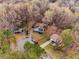 Real estate aerial view of the home with mature trees on an oversized lot at 3747 Junior Ln, Douglasville, GA 30135