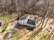 Aerial view of home showcasing its expansive yard and welcoming front porch at 3747 Junior Ln, Douglasville, GA 30135