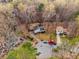 Real estate aerial view of the home with mature trees on large lot at 3747 Junior Ln, Douglasville, GA 30135