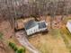 Aerial view showcasing the house with driveway and backyard at 3747 Junior Ln, Douglasville, GA 30135