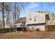 Backyard with deck, stairs, and partially fenced yard at 3747 Junior Ln, Douglasville, GA 30135
