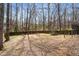 Spacious backyard features a trampoline and wooded privacy fence at 3747 Junior Ln, Douglasville, GA 30135