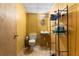 Small bathroom with toilet, sink, and shelving for storage at 3747 Junior Ln, Douglasville, GA 30135