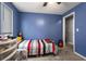 Cozy bedroom featuring carpet and an open doorway to an adjacent room at 3747 Junior Ln, Douglasville, GA 30135