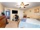 Bedroom with carpet, ceiling fan, ample dresser space and attached desk area at 3747 Junior Ln, Douglasville, GA 30135