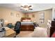 Bedroom with ceiling fan, neutral paint, carpet, and wooden furniture at 3747 Junior Ln, Douglasville, GA 30135