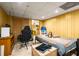 Bedroom with wood paneling, bed, and ceiling lights at 3747 Junior Ln, Douglasville, GA 30135