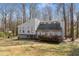 Charming split-level home features unique architecture, mature trees and a quaint front yard at 3747 Junior Ln, Douglasville, GA 30135