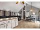 Spacious living room with vaulted ceiling, tile floor, and ample seating with a dining area at 3747 Junior Ln, Douglasville, GA 30135