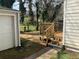Backyard featuring a small wood deck and detached single-car garage at 1132 Fair St, Atlanta, GA 30314